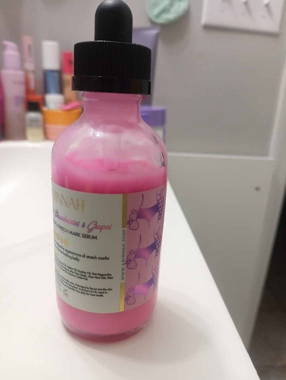 Aminnah Pink Stretch Mark Serum Bottle strawberry And Grape